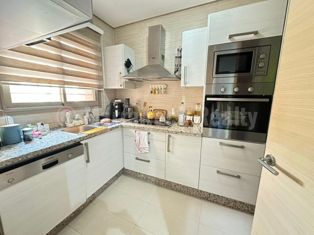 Appartement de trois pièces en rez-de jardin dans une résidence fermée